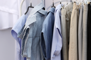 Shirts and pants displayed on a clothes rack